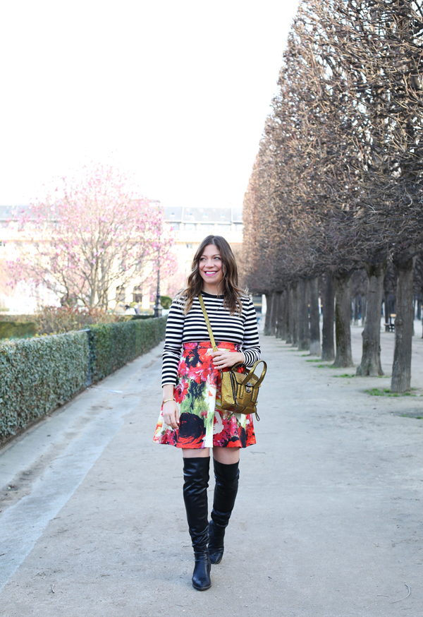 lifestyle blogger wearing stripes, a floral mini skirt and OTK boots in paris