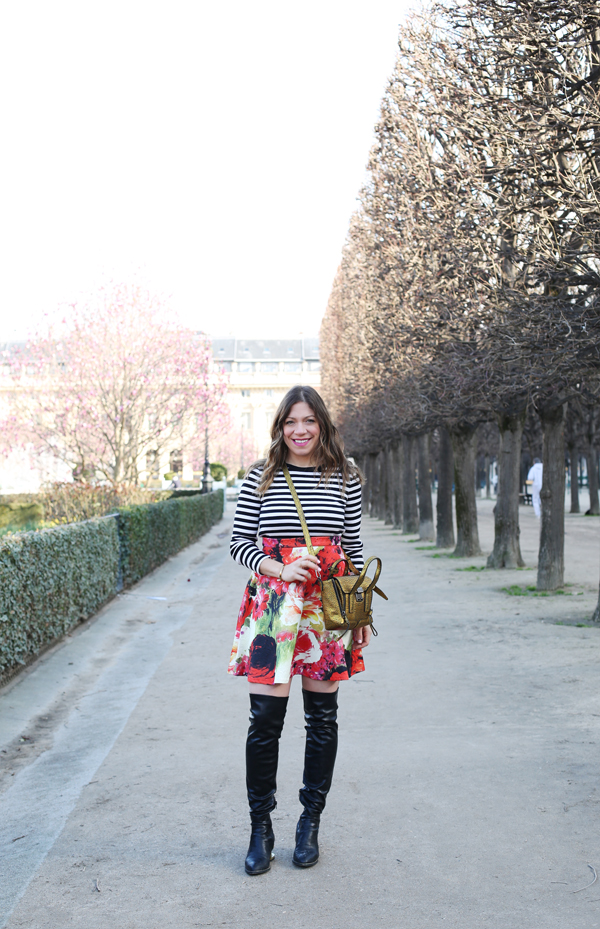 striped shirt, floral a-line skirt and over-the-knee black boots