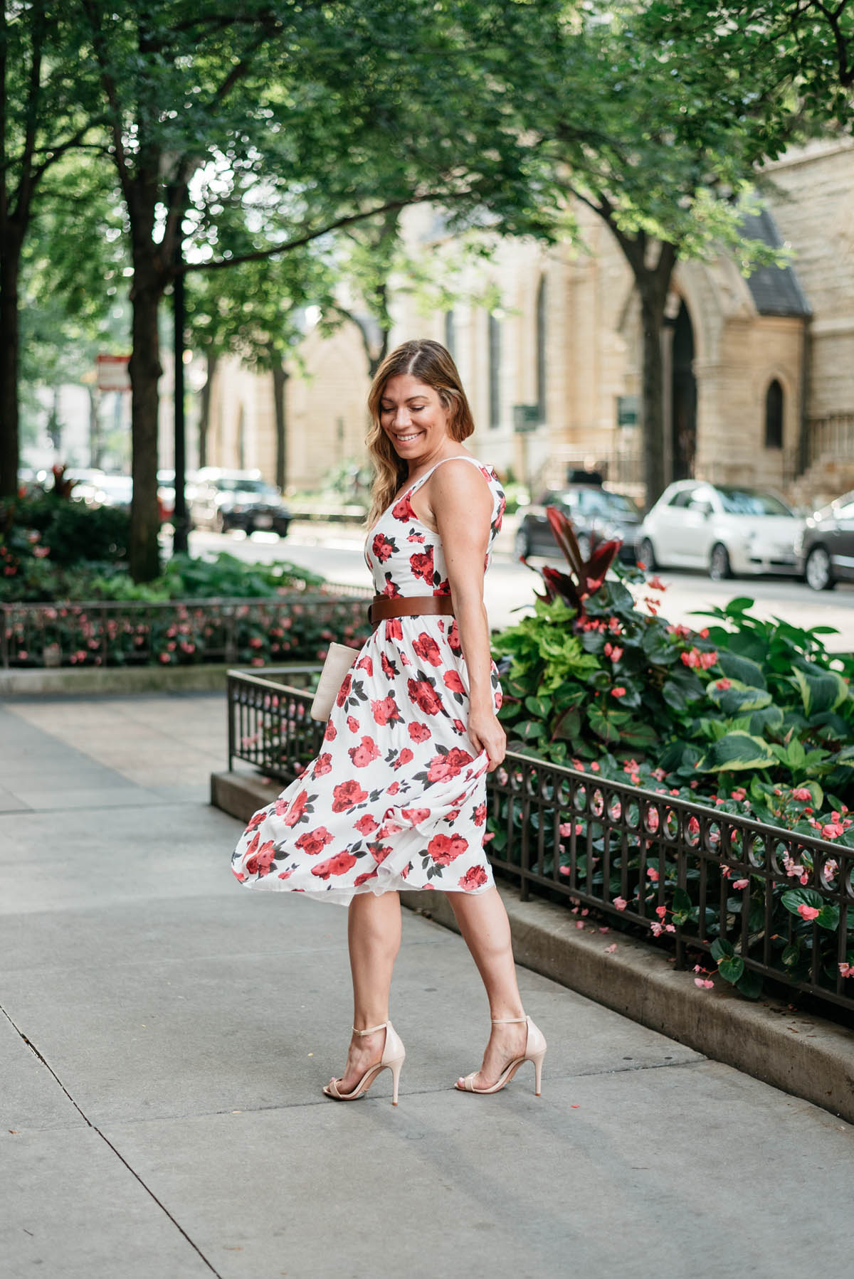 chicago blogger hallie wilson wearing a floral dress and nude sandals