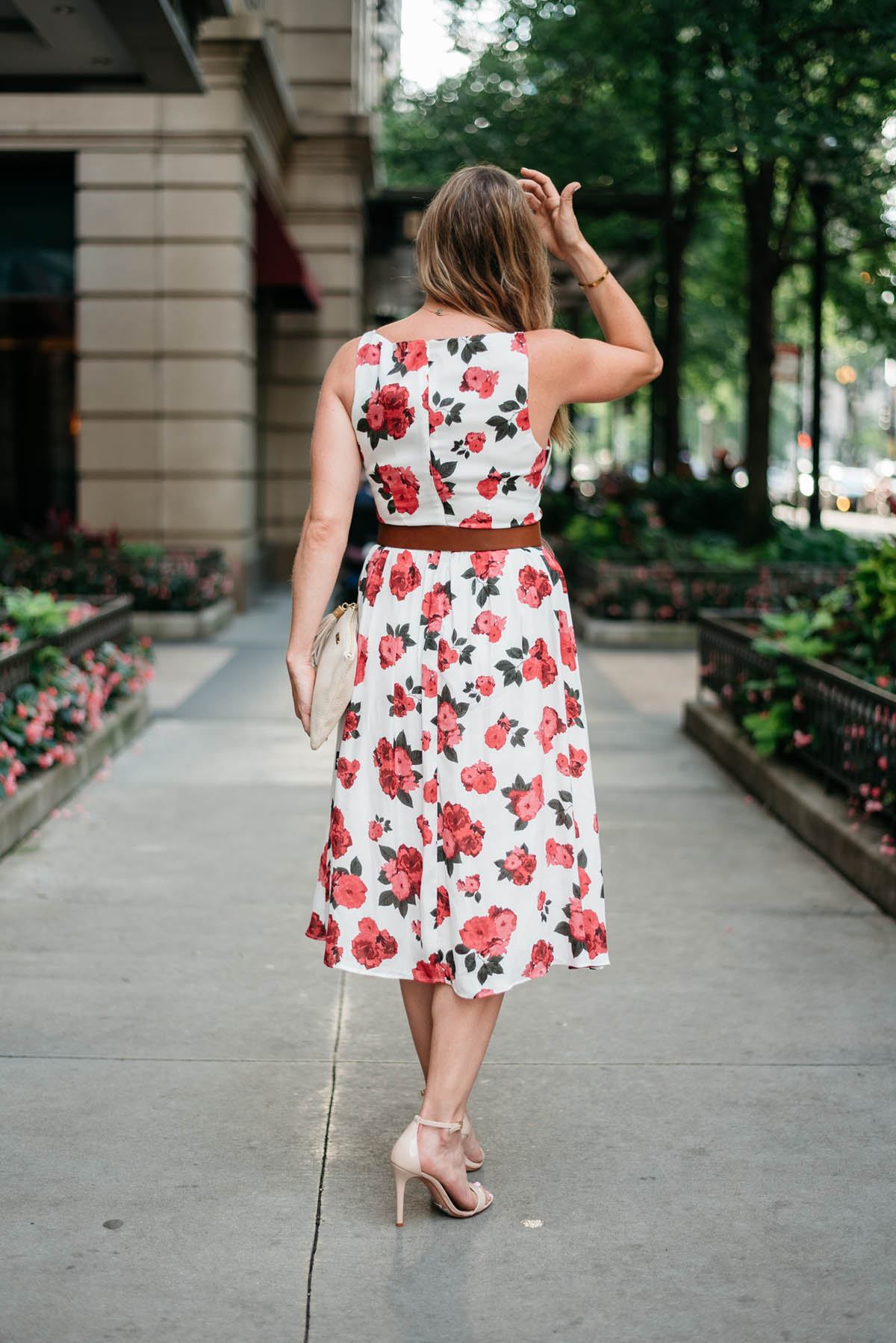 corals and cognacs wearing a cute printed dresses for an outdoor wedding in the summer