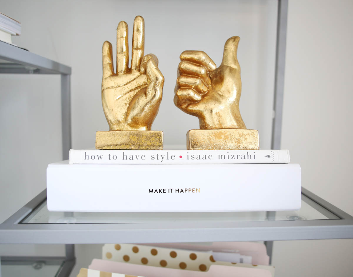 pretty gold hand figurines peace thumbs up