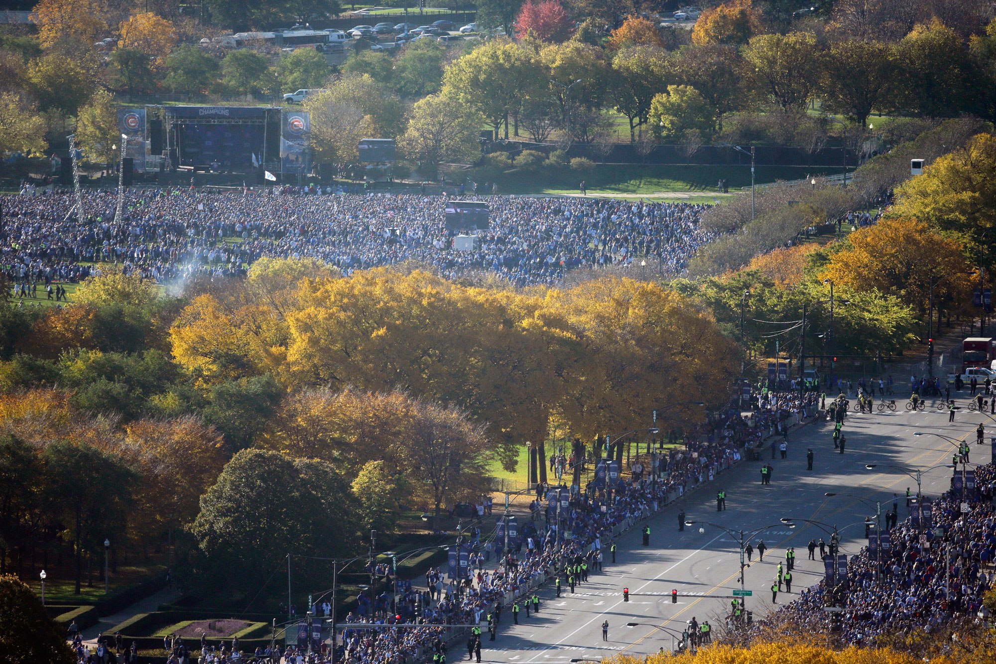 Fans gather at Grant Park for a parade honoring the World Series champion Chicago Cubs baseball team, Friday, Nov. 4, 2016, in Chicago. (AP Photo/Kiichiro Sato)